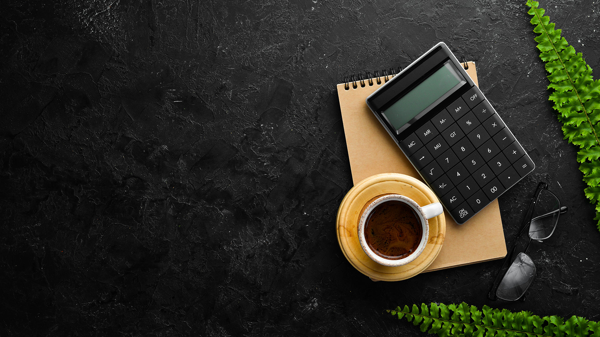 calculator, notepad and coffee